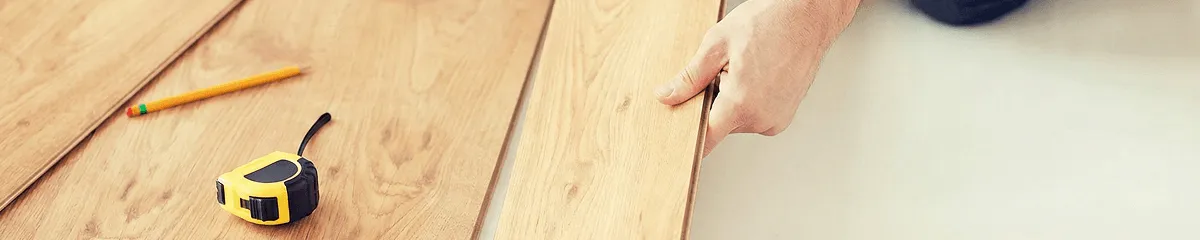 A professional installing wood flooring in Myrtle Beach, SC