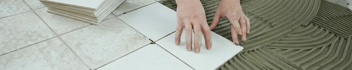 Professional installing white tile floors in Myrtle Beach, SC